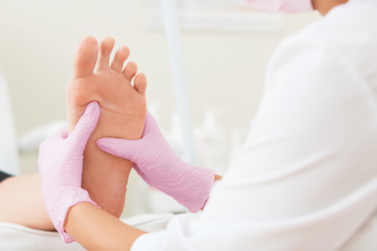 Podiatrist Massaging Feet